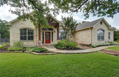  Home with pool on one-acre in The Colony of Bastrop